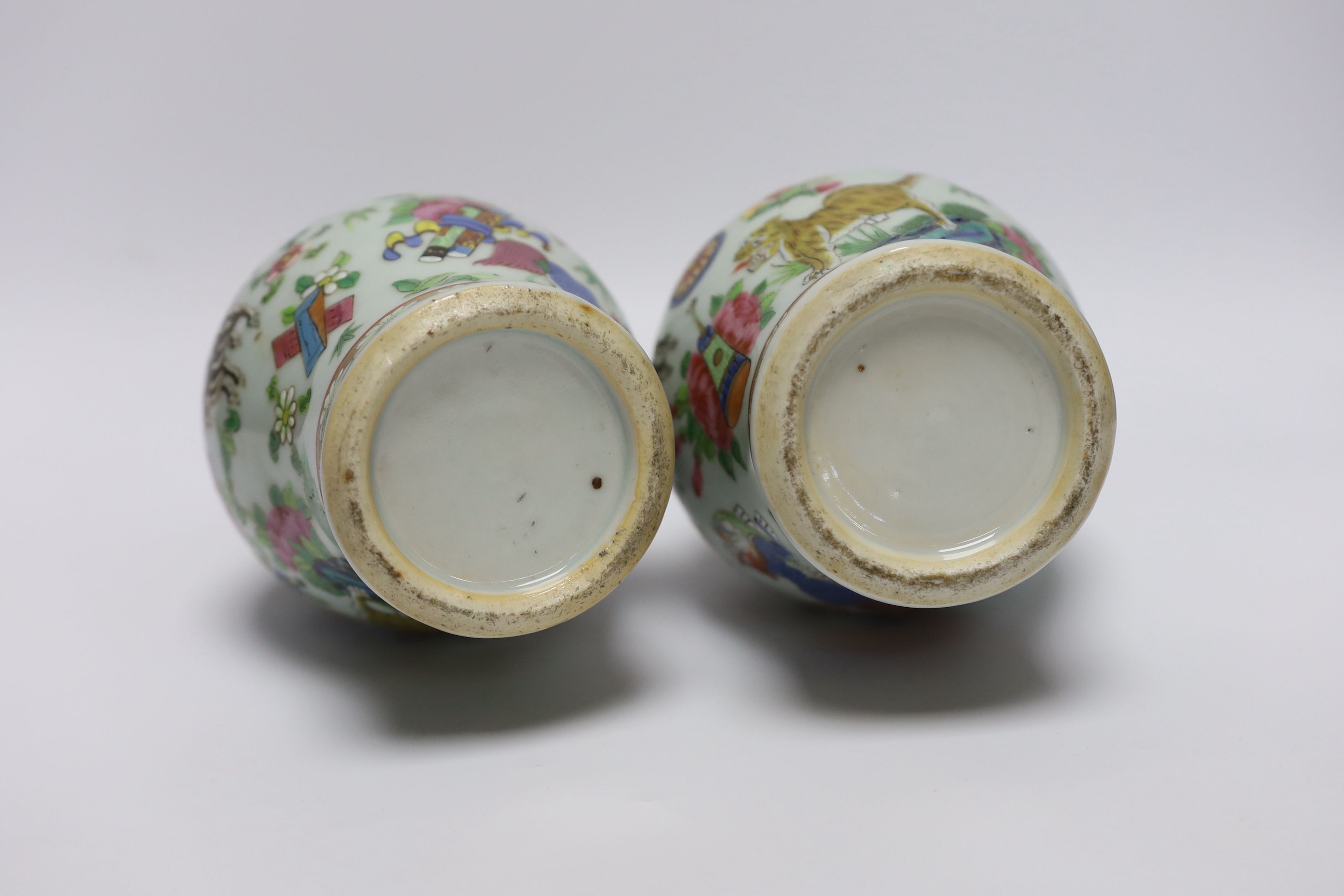A pair of 19th century Chinese famille rose ‘mythical beasts’ vases, 24cm